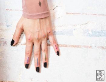 Colorful lines and dots on the hand