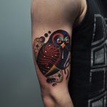 Colorful owl on the right bicep