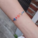 Colorful solar system armband tattoo