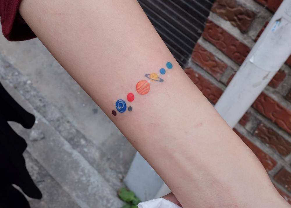 Colorful solar system armband tattoo