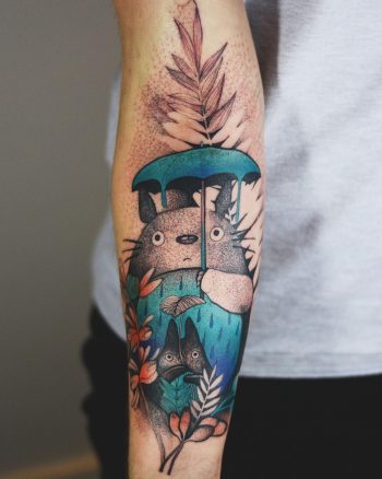 Colorful totoro tattoo on the inner forearm