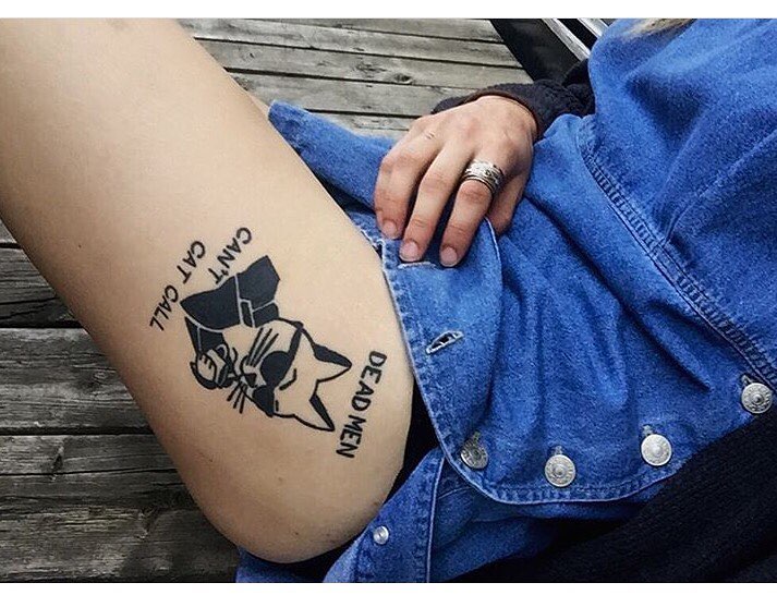 Cool cat tattoo on the left hip