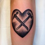 Crossed hammers tattoo
