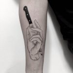 Cut hand tattoo