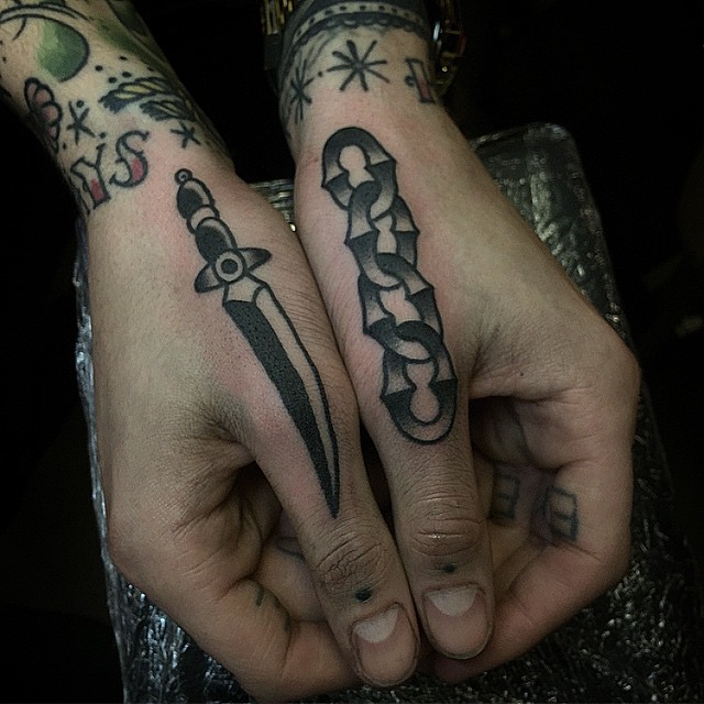 Dagger and chain tattoos