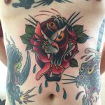 Deconstructed panther and rose tattoo