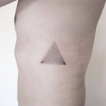 Dotwork style triangle tattoo on the rib cage