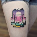 Double exposure backpack and landscape tattoo