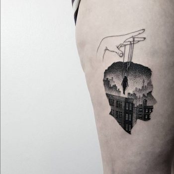 Double exposure head and city tattoo