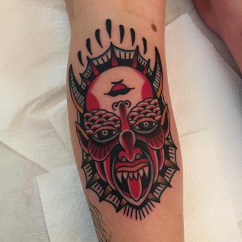 Face of a devil and a woman tattoo