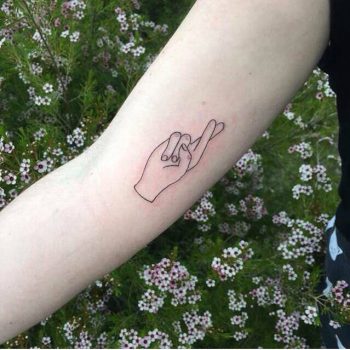 Fingers crossed minimal tattoo