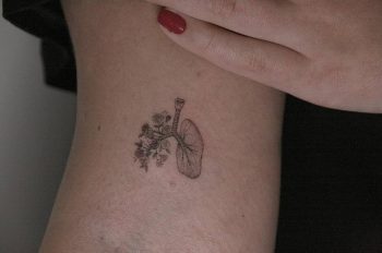 Floral lungs tattoo