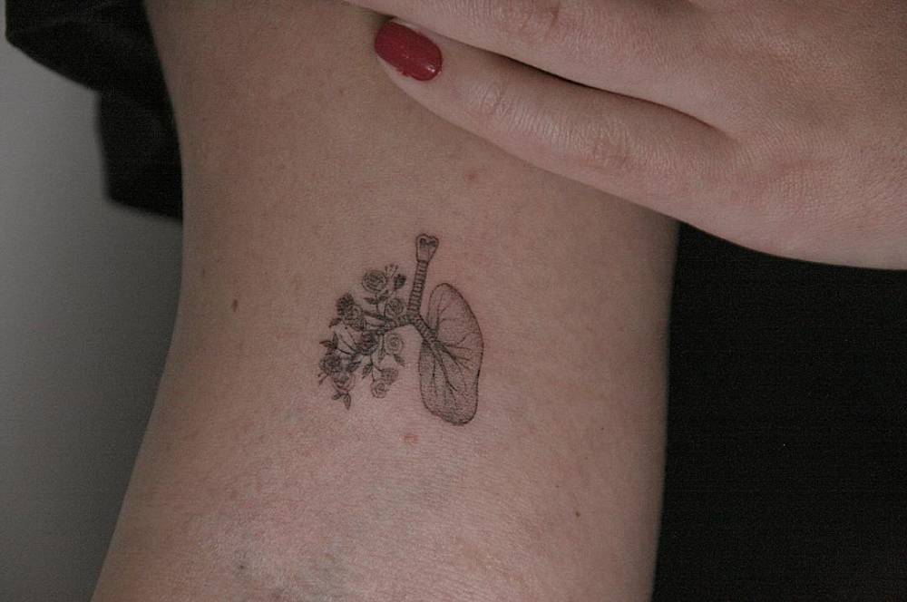 Floral lungs tattoo 