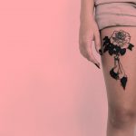 Flower and girl on the thigh