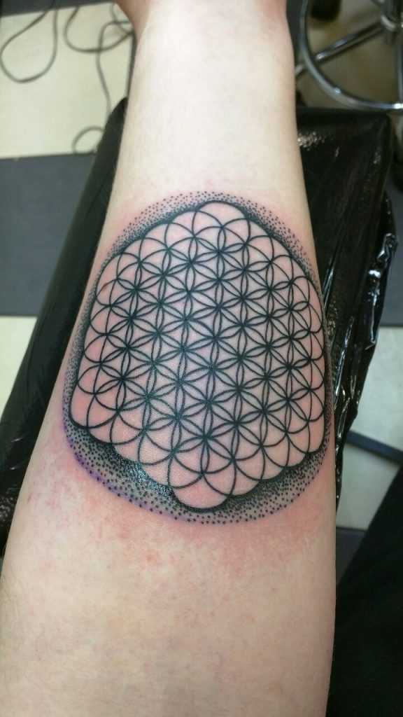 Flower of life tattoo on the forearm