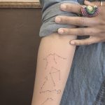 Four constellations tattoo on the right inner forearm