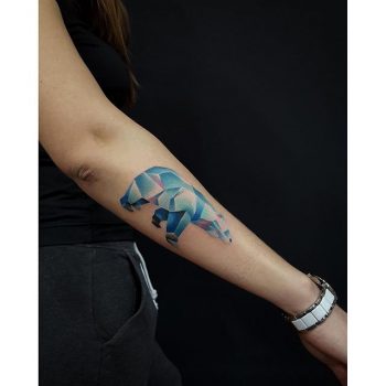 Geometric colorful polar bear tattoo