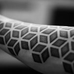 Geometric dotwork tattoo on the forearm