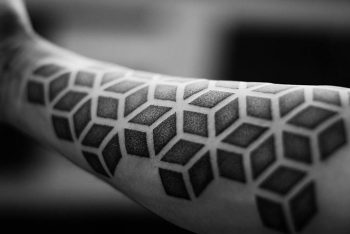 Geometric dotwork tattoo on the forearm