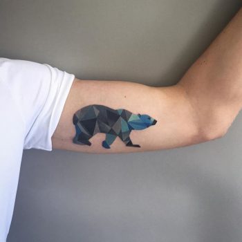Geometric polar bear tattoo on the bicep