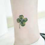Green clover tattoo on the ankle