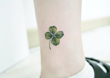 Green clover tattoo on the ankle