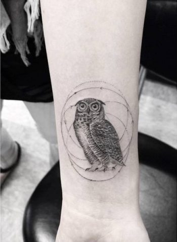 Hand poked owl tattoo
