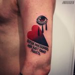 Heart eye and cyrillic quote tattoo