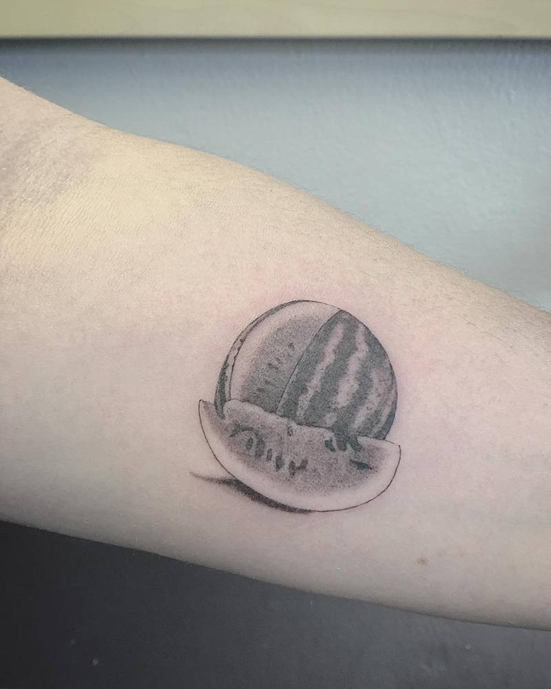Hyper realistic black and gray watermellon tattoo