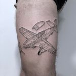 Linear black and grey airplane tattoo