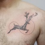Linear deer tattoo on the chest