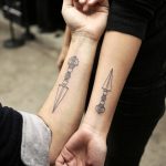 Matching ceremonial dagger tattoos