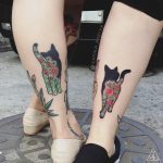 Matching floral cat tattoos