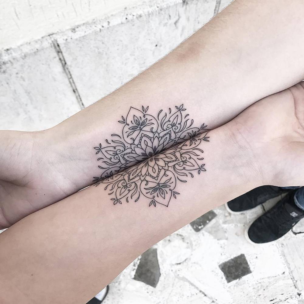 Matching floral pattern tattoo