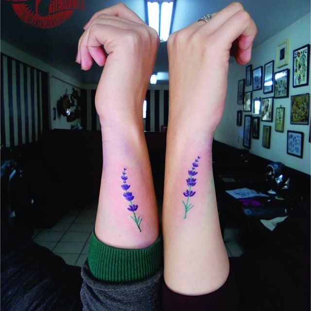 Matching violet flower tattoos