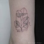 Minimal branch with leaves tattoo