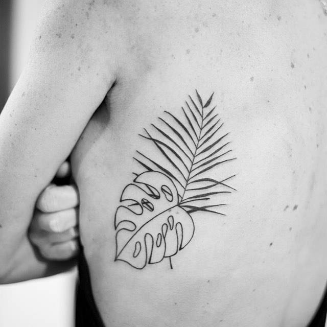 Monstera and palm leaf tattoo 