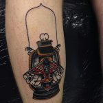 Moth and oil lamp tattoo