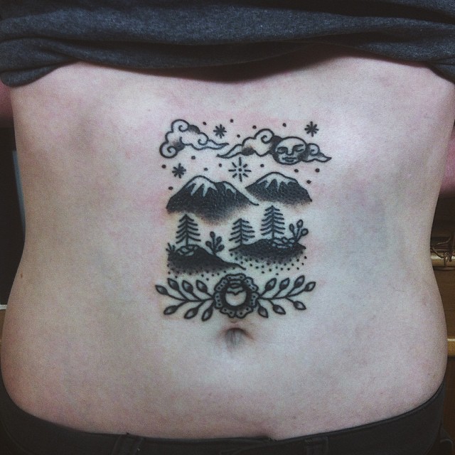 Mountains and plains landscape tattoo