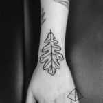 Oak leaf tattoo on the hand