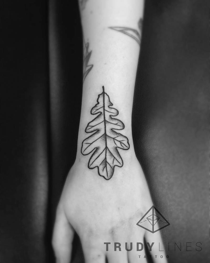Oak leaf tattoo on the hand