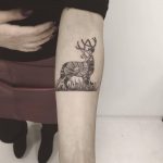 Ornamental deer tattoo