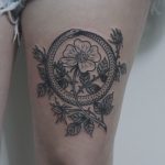 Ouroboros and flower tattoo