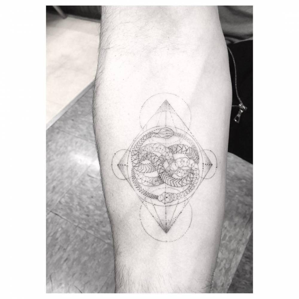 Ouroboros and geometric shapes tattoo
