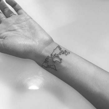 Outline wrist world map tattoo