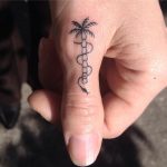 Palm tree and snake tattoo