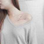 Pisces constellation tattoo on the collarbone
