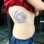 Pixel art spiral galaxy tattoo