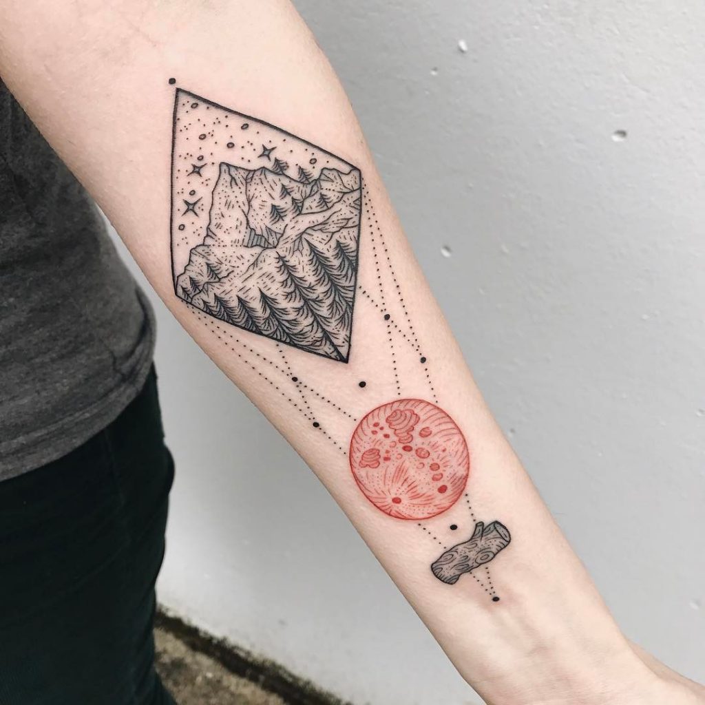 Rhombus shaped landscape and red circle tattoo