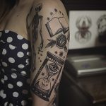 Skeleton book and hourglass tattoos
